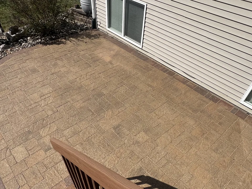 Paver patio with a seating area by Larkin Landscape and Design